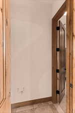 living room door that accesses laundry room for west wing of house and additional bedrooms.