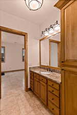 Bathroom with vanity and light tile patterned floors