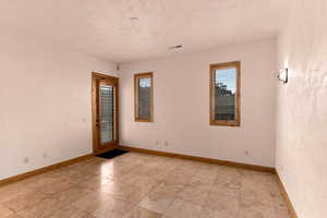 Unfurnished bedroom with outside access