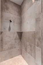 Full bath with tiled shower