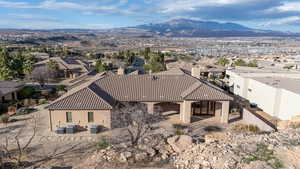 Aerial view of residential area featuring a mountain backdrop