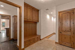 Mudroom featuring baseboards and recessed lighting