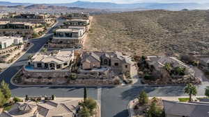 Aerial perspective of suburban area with a mountain backdrop