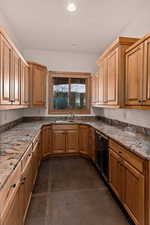 Butler's Kitchen featuring wine cooler, light stone countertops, recessed lighting, and concrete floors
