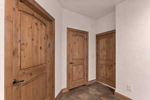 Great room looking towards staircase area, laundry room, utility closet, and storage room under the stairs