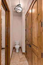 Full bathroom with light tile patterned floors and a textured ceiling