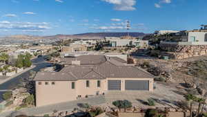 Aerial view of residential area featuring a mountainous background
