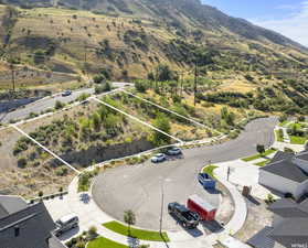 Aerial overview of property's location featuring property parcel outlined and mountains