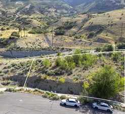 Aerial view of property's location featuring mountains and property parcel outlined