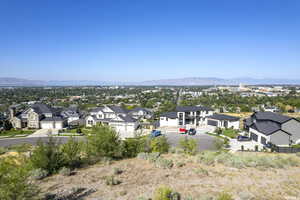 Aerial perspective of suburban area featuring a mountainous background