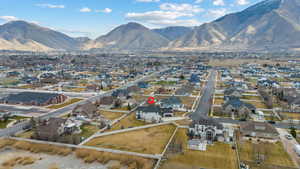 Aerial perspective of suburban area featuring a mountain backdrop