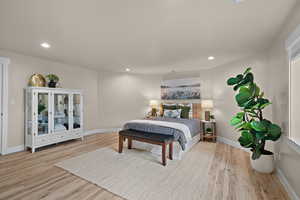 Bedroom featuring light wood finished floors and recessed lighting