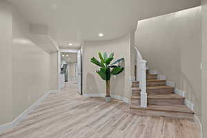 Entryway featuring light wood-style floors and recessed lighting