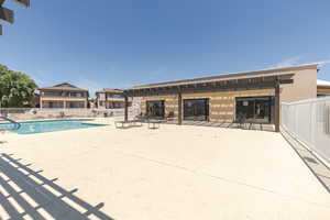 Community pool featuring a patio area