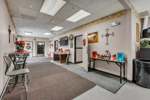 Welcome area featuring a paneled ceiling