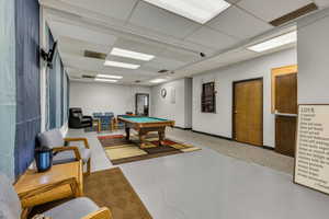Game room featuring pool table and a drop ceiling