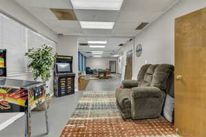 Game room with a paneled ceiling and billiards table