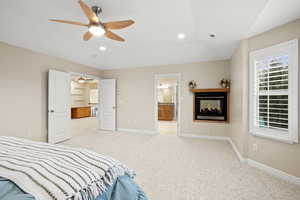 Primary bedroom features a multi sided fireplace and ensuite bath.