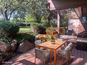 Deck featuring outdoor dining area and area for grilling