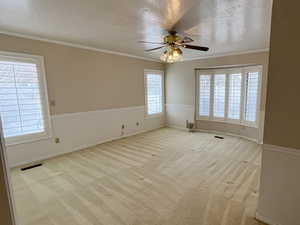 Large master bedroom with lots of light, storage and plantation shutters.