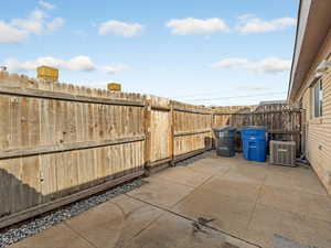 Fenced backyard with a patio area