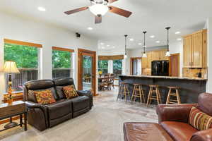 Living room featuring recessed lighting, a ceiling fan, and light tile patterned floors