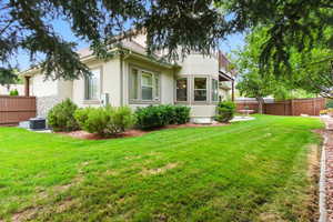 Rear view of house with stucco siding