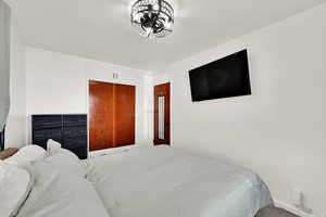 Bedroom featuring a closet and carpet floors