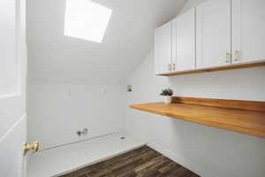 Laundry room with storage cabinets, floating counter and adorable dutch door