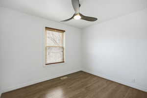 Bedroom  with wood-look flooring and a ceiling fan