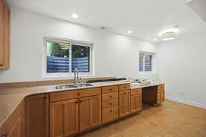 Craft or hobby room with built-in cabinets and counters. Could be converted to a kitchenette if desired