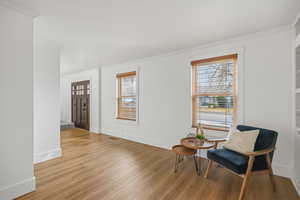 Perfect for a formal living room, music room or office. Featuring wood-look floors and built in cabinets