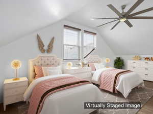 Bedroom featuring a ceiling fan and wood-look floors