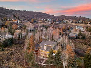 Aerial view at dusk of a residential view and a mountain view