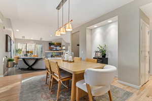 Dining room featuring light wood-style floors and recessed lighting