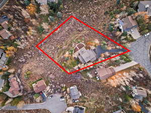 Aerial view of property's location featuring property boundaries highlighted and nearby suburban area