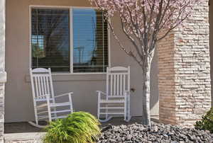 View of exterior entry with stucco siding