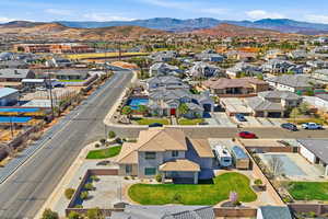 Aerial perspective of suburban area featuring a mountain backdrop