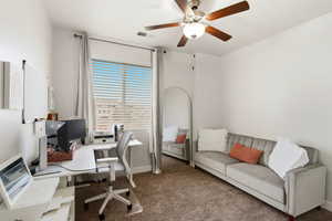 Office area featuring carpet flooring and ceiling fan