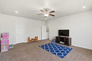 Playroom with recessed lighting, a ceiling fan, and carpet