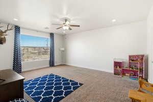 Playroom featuring light colored carpet, a ceiling fan, and recessed lighting
