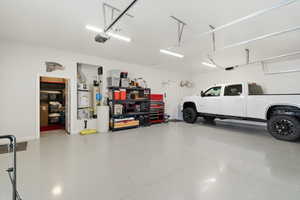 Garage with secured water heater and baseboards