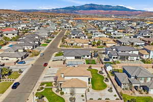 Aerial perspective of suburban area with a mountainous background