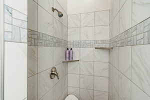 Bathroom with tiled shower
