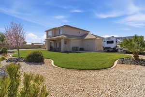 Back of house featuring a patio area and stucco siding