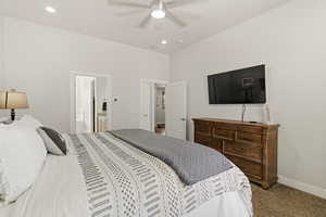 Bedroom featuring carpet floors, a ceiling fan, ensuite bath, and recessed lighting