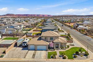Aerial perspective of suburban area with a mountainous background