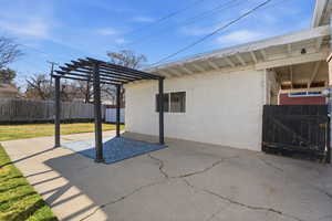 View of patio / terrace with a pergola and a gate