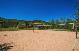 View of home's community featuring volleyball court and a mountain view