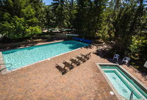 Community pool with a patio area